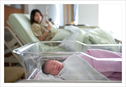Picture of a mother with a baby in a hospital room.