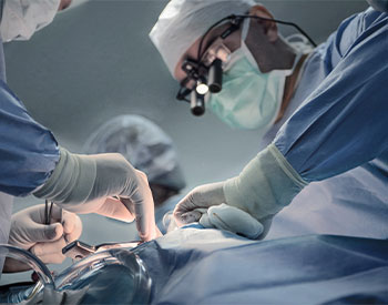Surgeon Team is performing an operation on a patient in an operation room